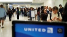 Travelers wait in line for their delayed luggage after United Airlines grounded flights due to a tech outage at Newark Liberty International Airport in Newark, New Jersey, U.S., August 6, 2025.  - Fox Business News