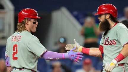 Philadelphia Phillies center fielder Brandon Marsh (16) celebrates with center fielder Harrison Bader (2) after hitting a two-run home ruin against the Miami Marlins during the fourth inning at loanDepot Park on Sept. 5, 2025. - Fox Business News