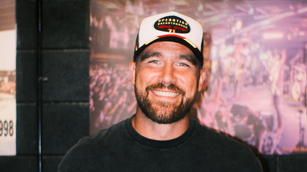 Travis Kelce, the Kansas City Chiefs star tight end, smiles at his foundation's third annual "Kelce Car Jam," sponsored by Raising Cane's. - Fox Business News