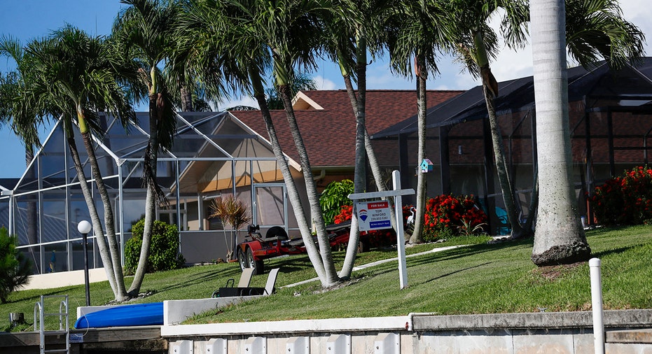 Cape Coral home backyards with for sale sign