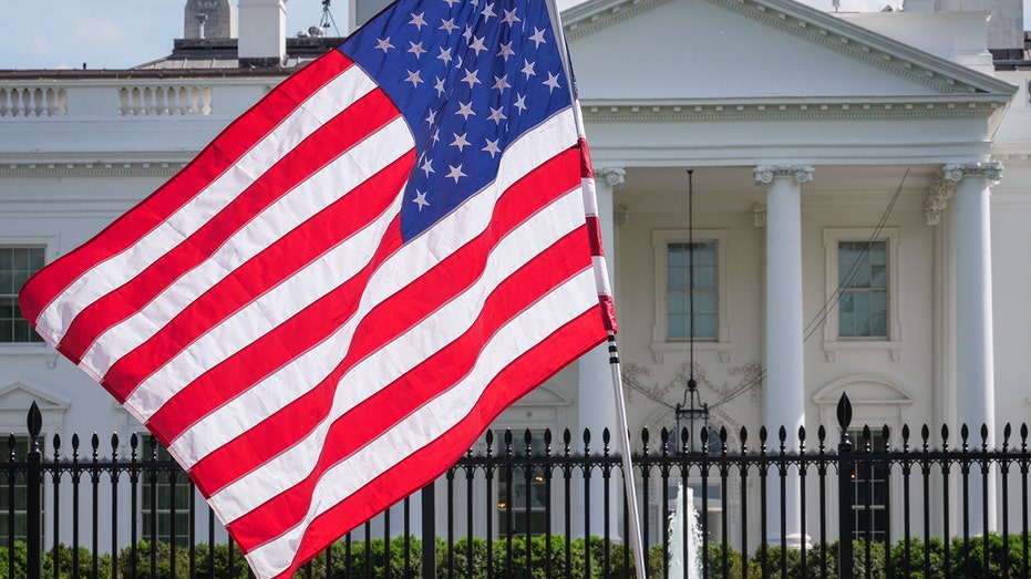 The U.S. Flag waves in front North Portico of the White House on April 30, 2025, in Washington, DC.