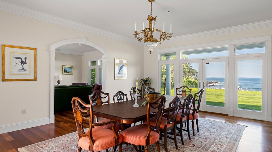 The dining room features a table large enough for 10 diners.