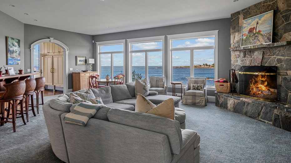 The family room boasts a fireplace, bar and an informal dining area with a view of the ocean.