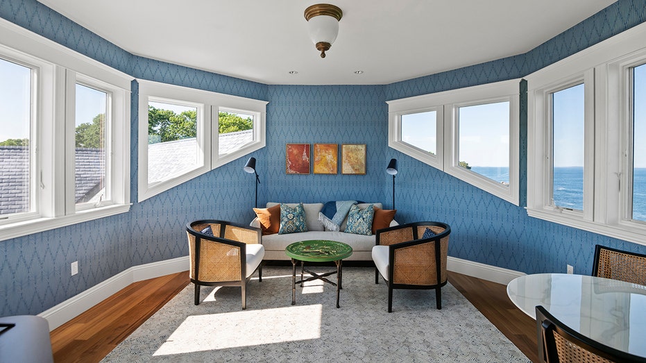 Another sitting room can be found on the upper level of the home.