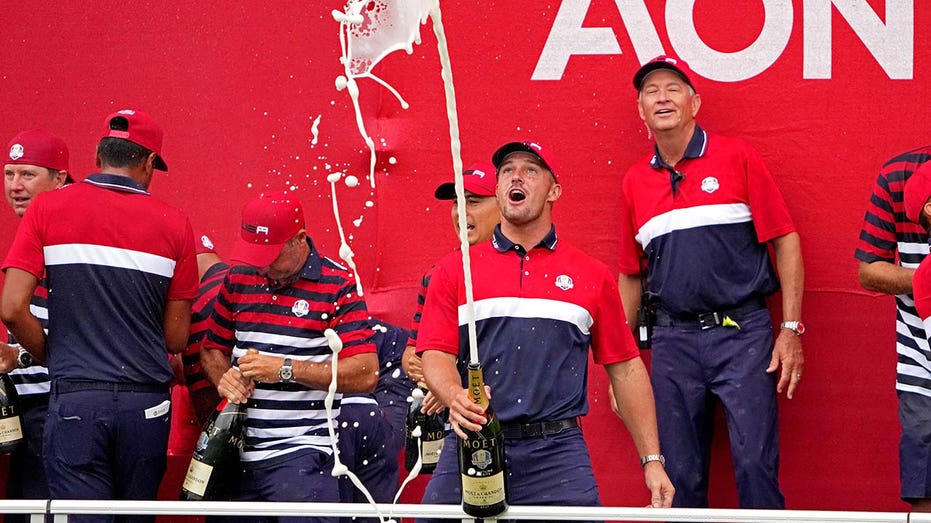 Bryson spraying champagne