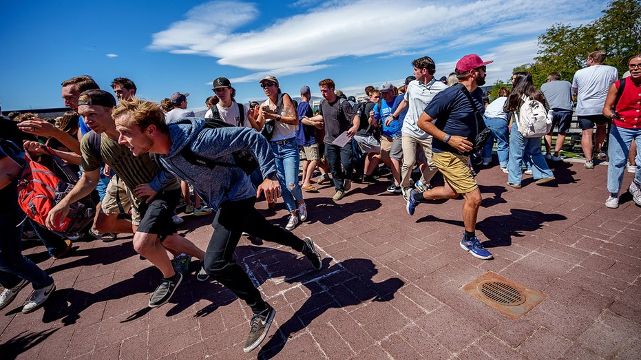 Students running during the assassination of Charlie Kirk