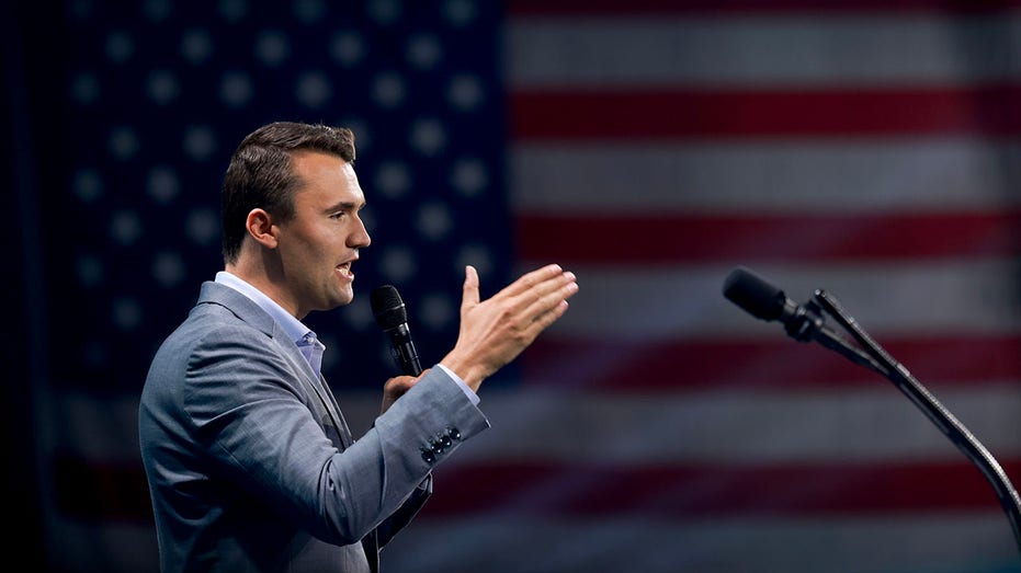 Charlie Kirk, who founded Turning Point USA, speaks before former President Donald Trump's arrival during a Turning Point USA Believers Summit conference at the Palm Beach Convention Center.