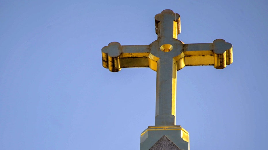 A Christian cross at the head of the Catholic Church