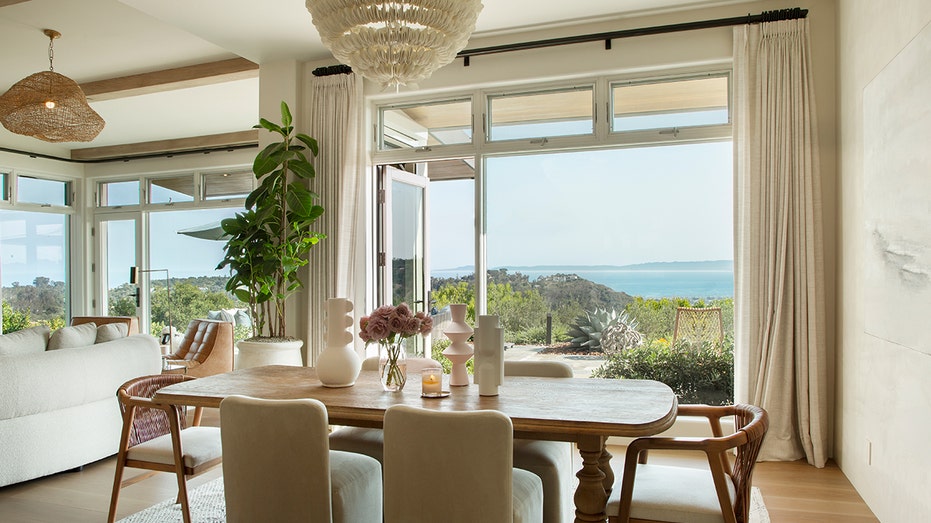 The dining room boasts views of the Pacific Ocean and the harbor.