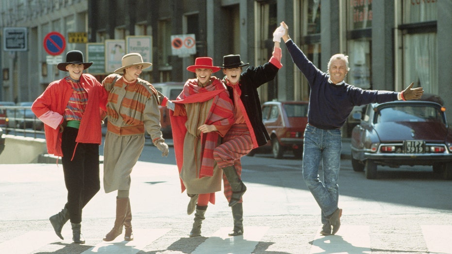 Giorgio Armani with models