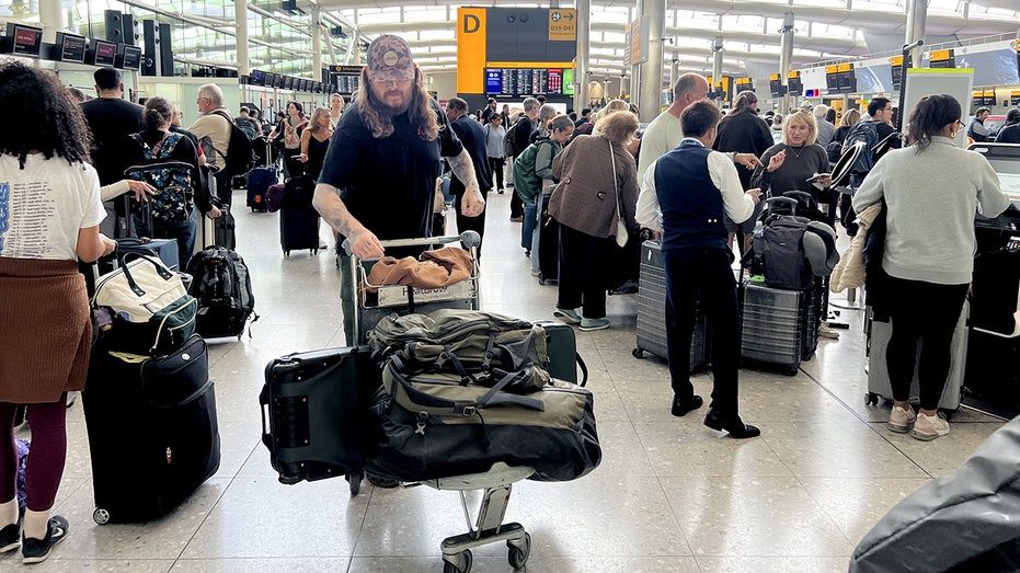 People at T2 London Heathrow Airport, after flights were delayed and cancelled.