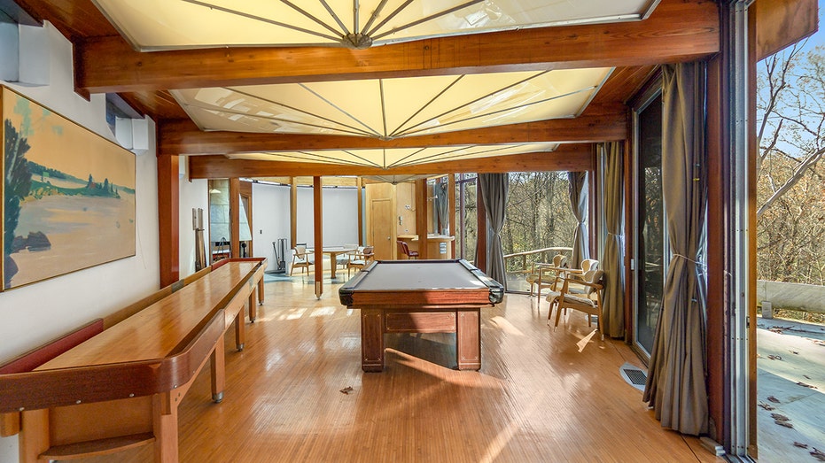 The game room with a lake table and shuffleboard.