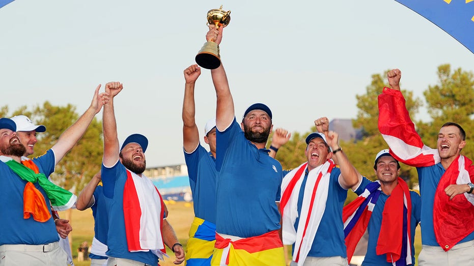 Jon Rahm holding trophy