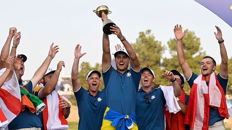 Ludvig Aberg with Ryder Cup trophy