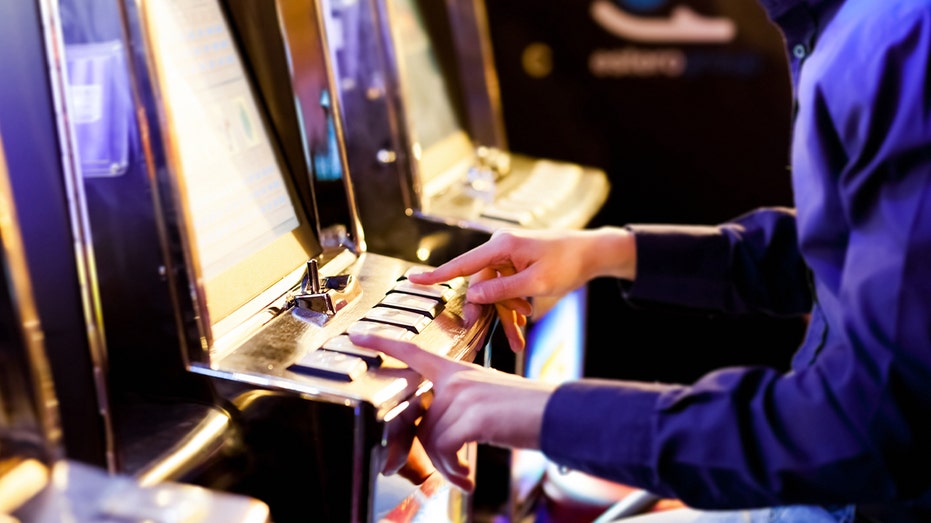Man plays on slot machine