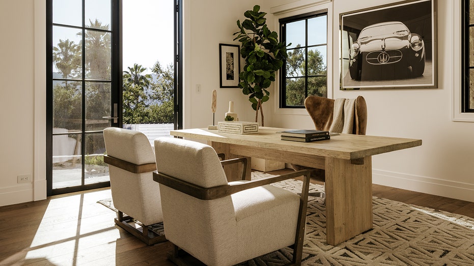 The home office features access to the backyard.