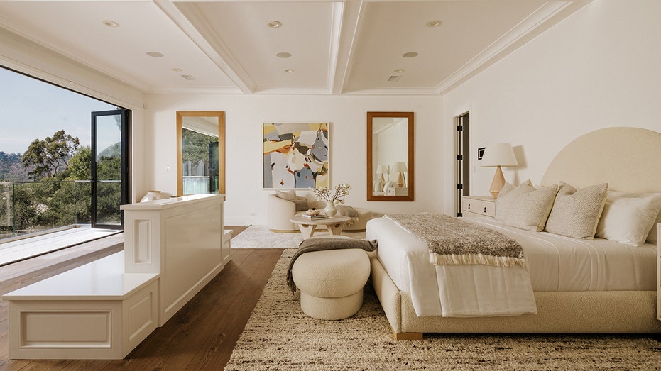 The spacious primary bedroom features access to a private terrace.