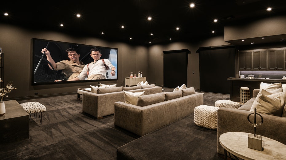 The home also features a home theater with a large projection screen.