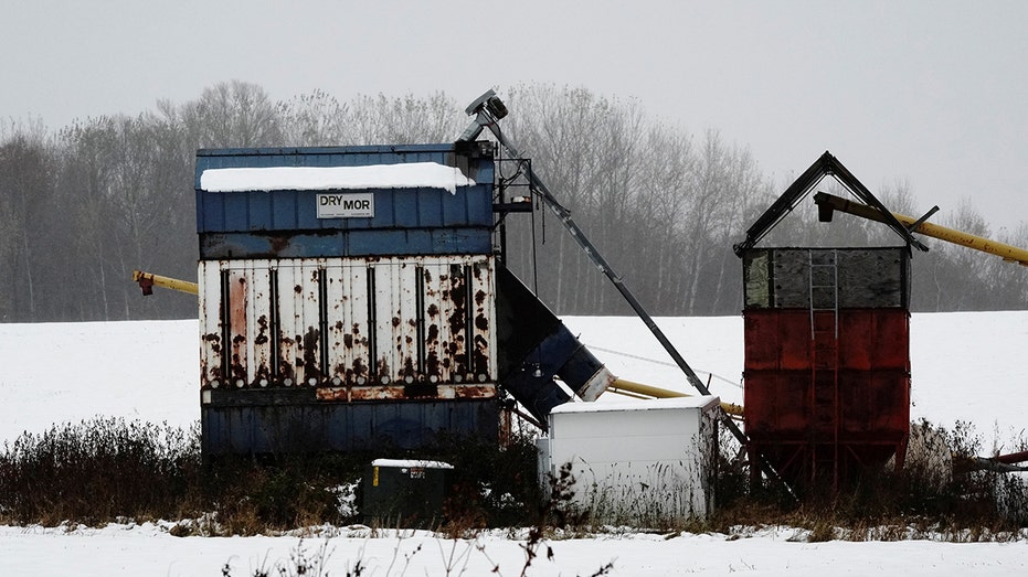 Agricultural equipment is covered with snow in Menomoni and Wisconsin