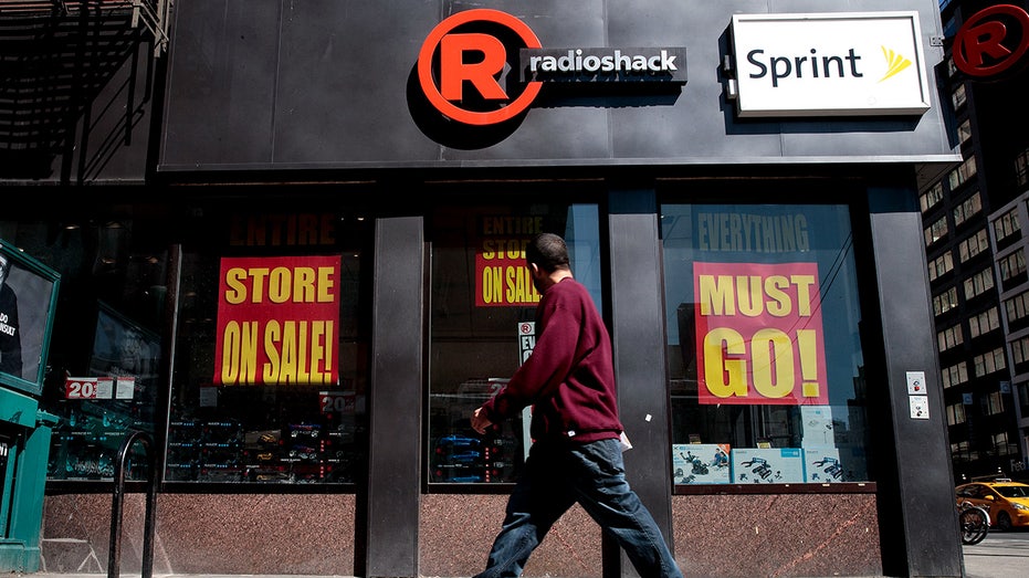 A man walks past a RadioShack storefront in New York City.