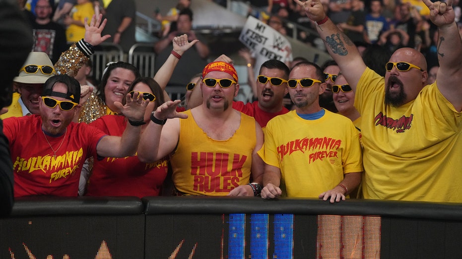 Fans wearing "Hulkamania Forever" merchandise