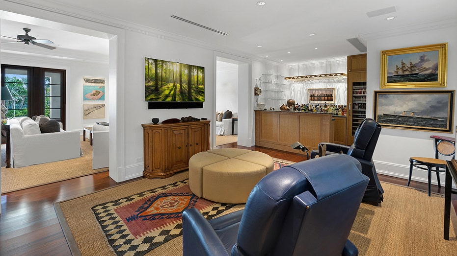 The home also features a TV room with a fully stocked bar.