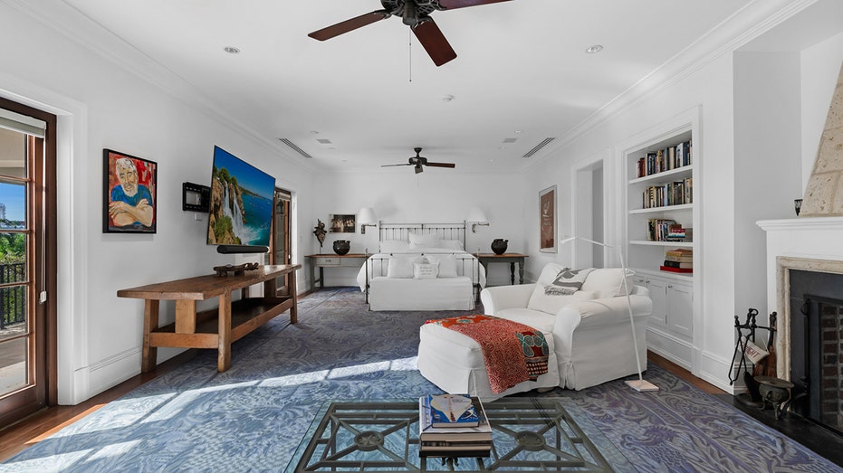The primary bedroom features ample space and access to a private terrace.