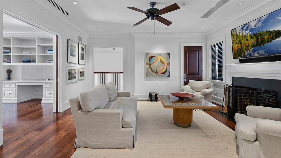 A separate TV room with a fireplace can be found elsewhere in the home.