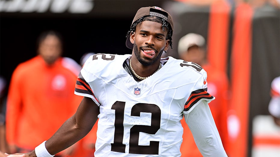 Shedeur Sanders looks on
