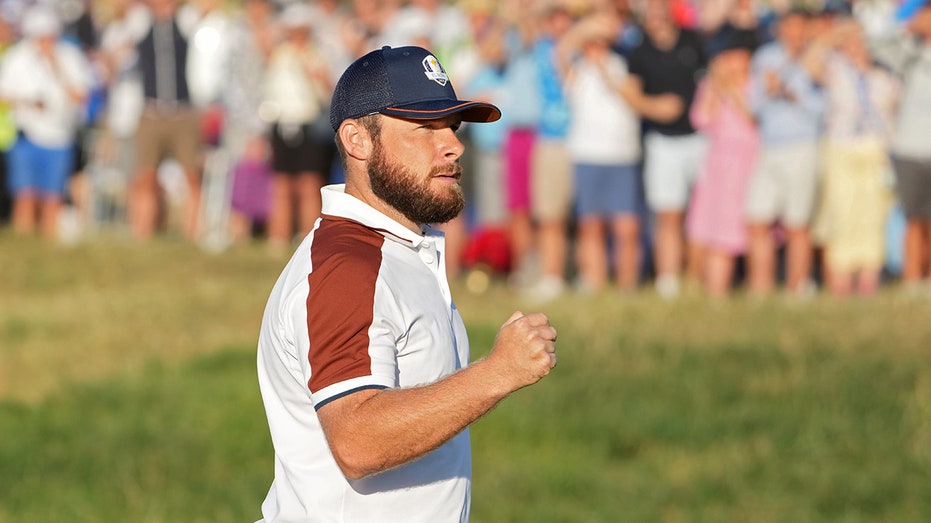 Tyrrell Hatton celebrating putt