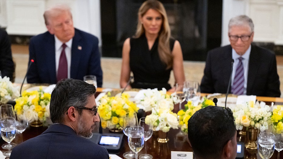 Sundar Pichai sitting across from Trump at a table