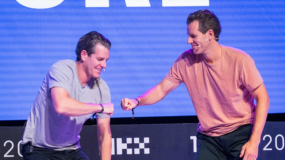 Cameron Winklevoss, co-founder and president of Gemini Trust Co., center, with his brother Tyler Winklevoss, co-founder and chief executive officer, during the Token2049 conference in Singapore, in 2023.
