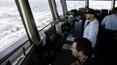 Air traffic controllers talk with pilots inside the control tower at Los Angeles International Airport (LAX) in  Los Angeles, California, U.S., June 24, 2016.  - Fox Business News
