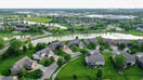 Spring has transformed the neighborhood. Wichita, Kansas gives evidence that spring arrived. The colors of spring appear around the beautiful homes and landscapes as seen above the houses, from a drone. - Fox Business News