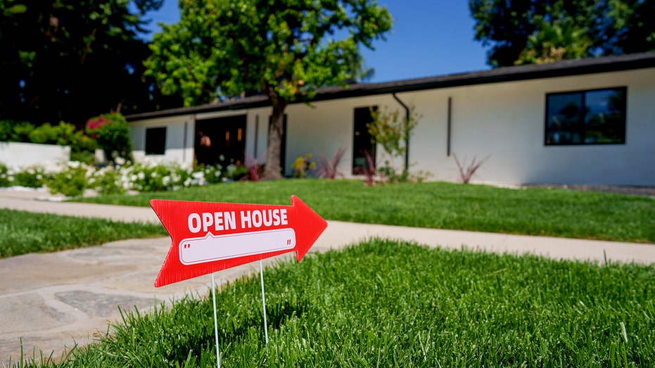Open house sign near single-family home
