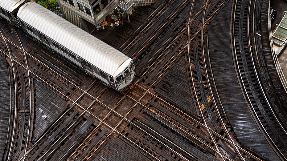 Chicago Transit Authority train travels along tracks in Loop neighborhood