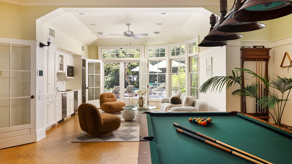 Home also boasts a game room with a Billiards table.
