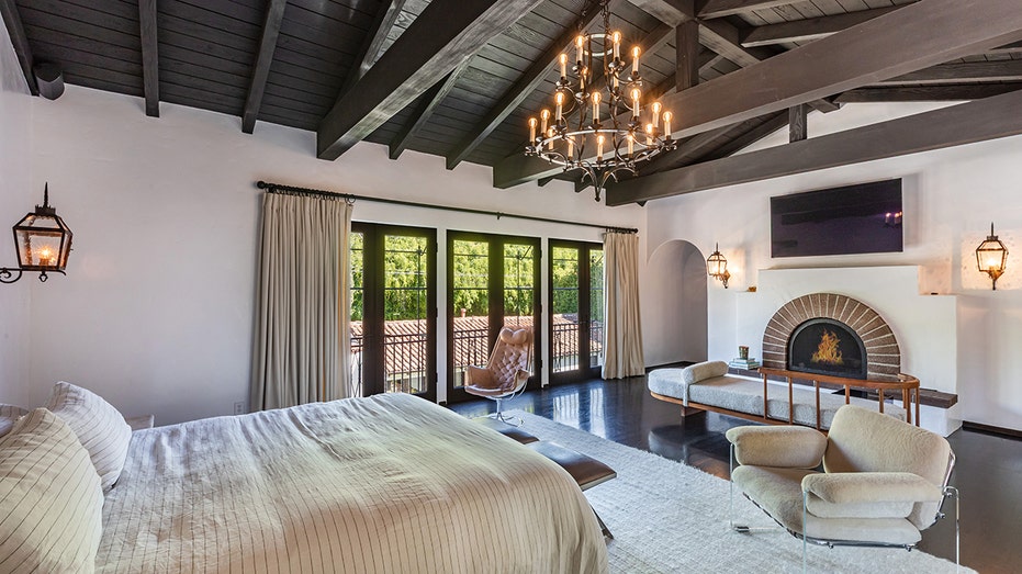 The primary bedroom has a Juliet balcony and a fireplace.