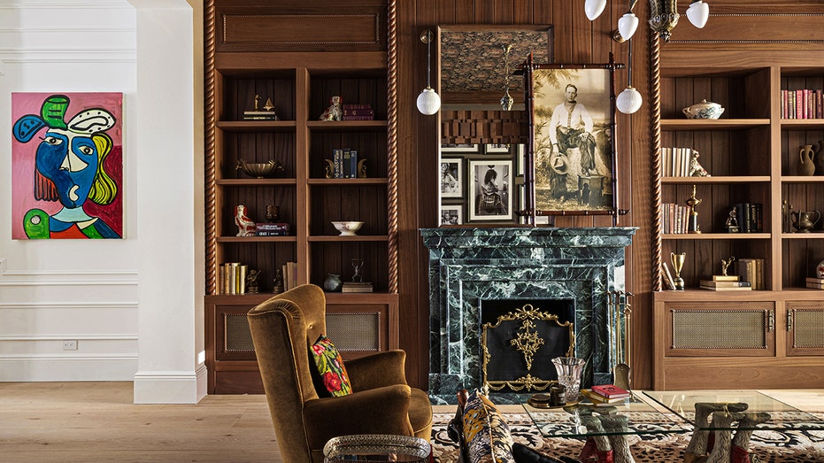 The home also has a second living room with a fireplace and built-in shelving.