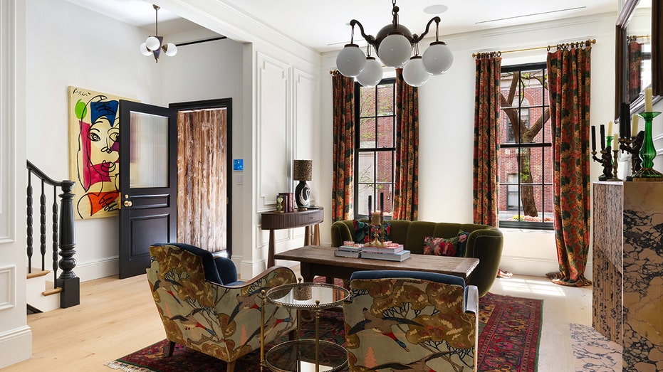 The home's living room features a fireplace and street views.