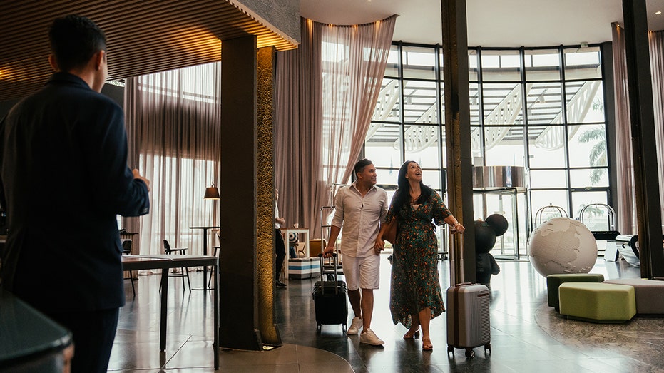 A couple walking into a hotel