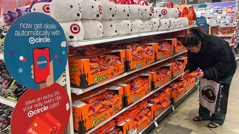 Person in NYC looks at Halloween candy on sale at store