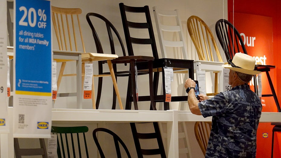 Customers shop for furniture at the IKEA store