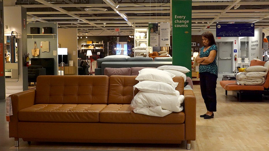 Customers shop for furniture at the IKEA store.