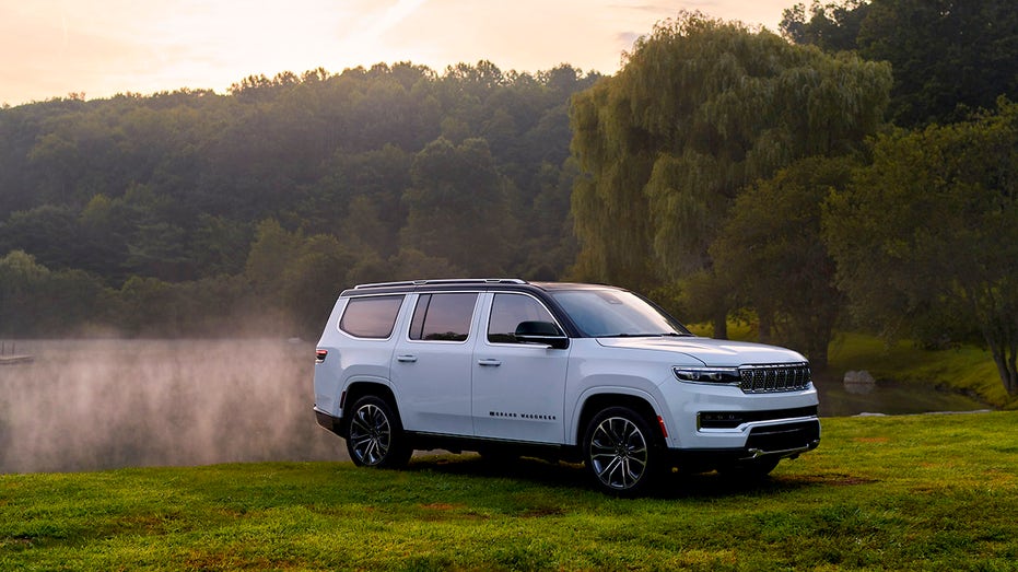 A 2025 Jeep Grand Wagoneer parked in some grass.