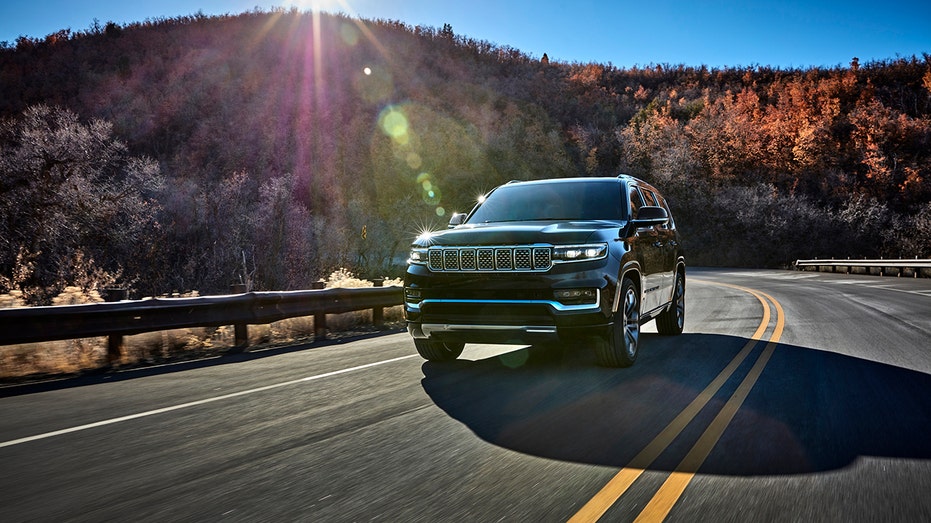 A 2025 Jeep Grand Wagoneer driving down the highway.