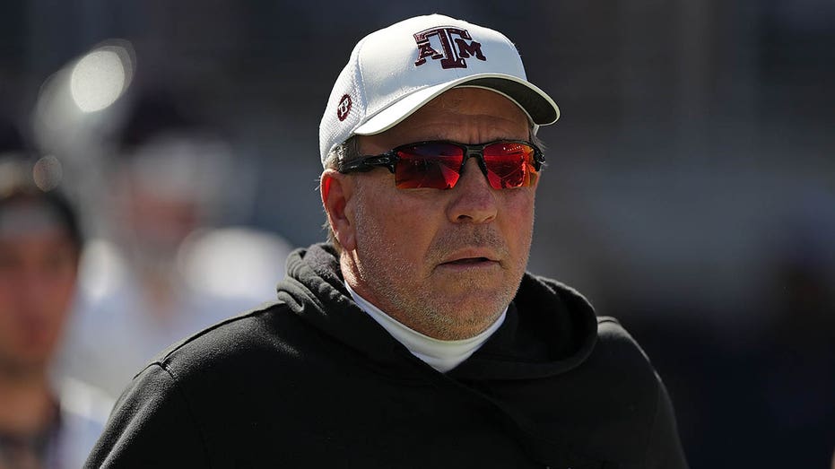 Jimbo Fisher walks on field