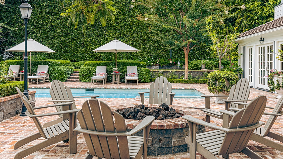 The backyard features a firepit.