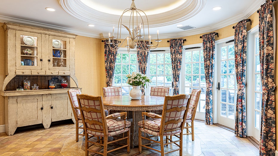 The kitchen also includes an informal dining area.