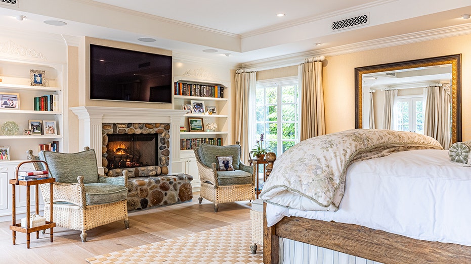 The primary bedroom features a wood-burning fireplace.